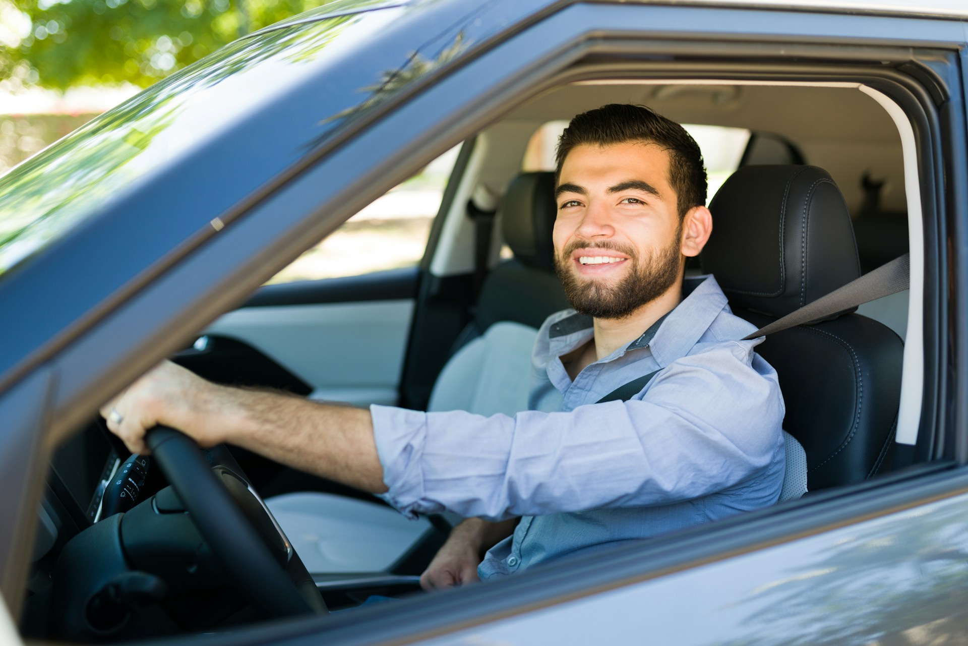 Man driving a car.
